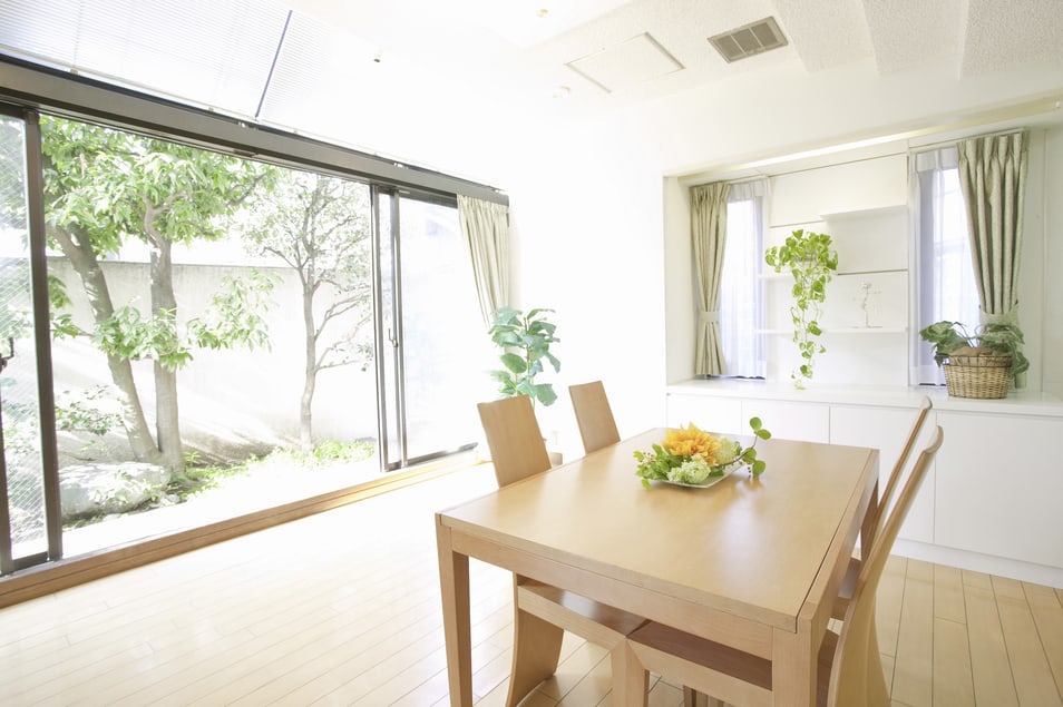 A dining table in a naturally bright room