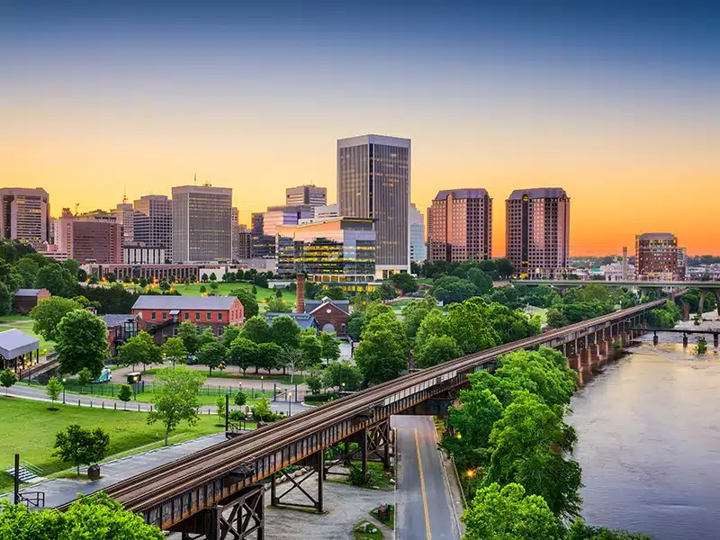 Skyline view of city with a bridge running through the frame